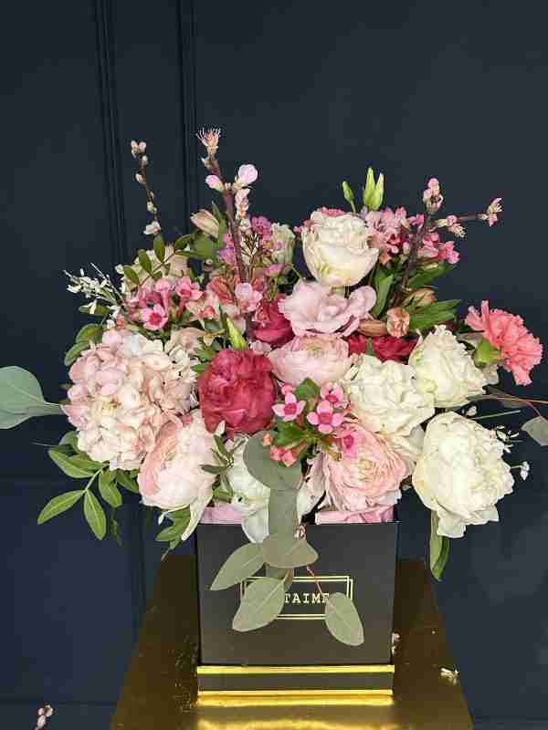 box of rose and white flowers